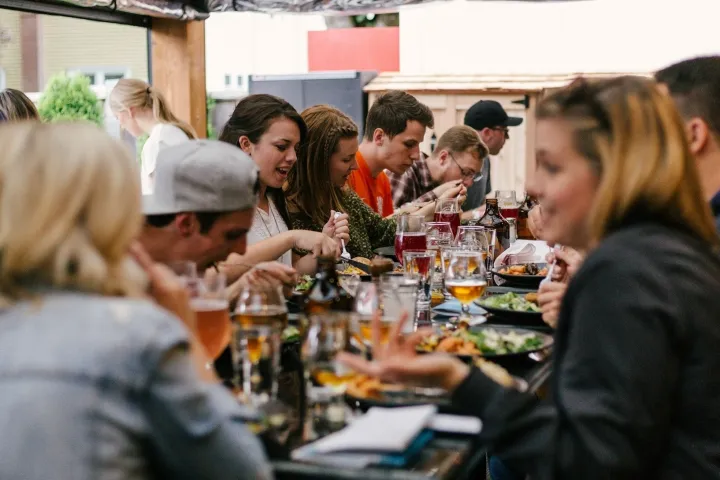 a group of people sitting at a table